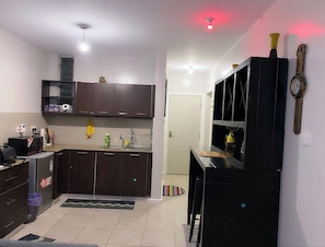 Fridge, microwave, electric kettle, cookware/dishes/utensils