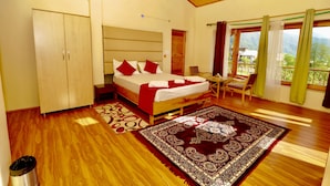 A bedroom with a bed, a desk, a chair, and a view of the outdoors. - Zaara resort, hidden resort in manali (Manali)