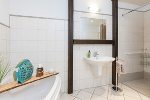 Bathtub, hair dryer, bidet, towels