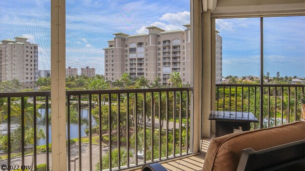 A balcony with a view of a water body and buildings. - GRAND EXECUTIVE 3B/3B WATERSIDE 246 ISLAND CONDO (Fort Myers Beach)