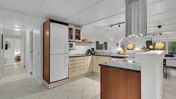 Fridge, stovetop, dishwasher, coffee/tea maker