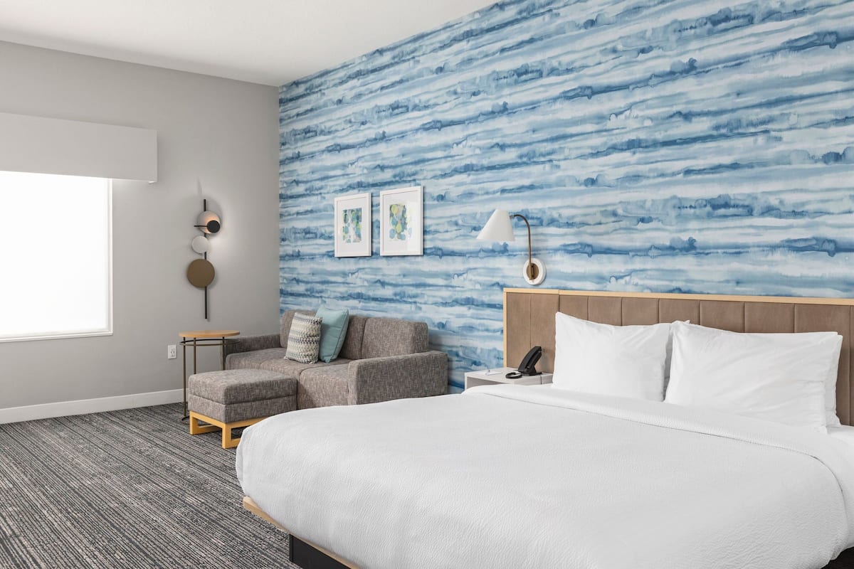 Premium bedding, laptop workspace, blackout curtains, iron/ironing board