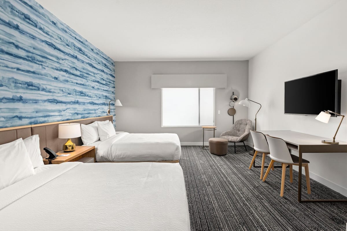 Premium bedding, laptop workspace, blackout curtains, iron/ironing board