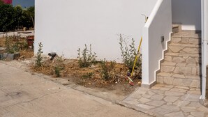 A modern white building with a unique staircase design. - Lungo Mare (Rhodes)