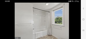 Combined shower/tub, hair dryer, towels, soap