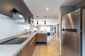 Coffee/tea maker, fridge, microwave, oven