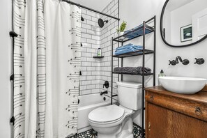 Combined shower/tub, hair dryer, towels, soap