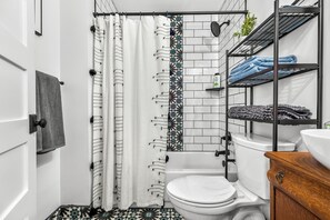 Combined shower/bathtub, hair dryer, towels, soap