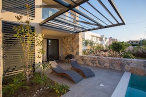 Superior Suite, 1 King Bed, Non Smoking, Pool View | Living area | Flat-screen TV