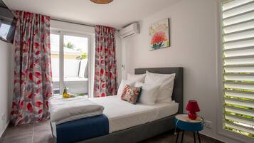 Exclusive Suite, 1 Queen Bed with Sofa bed, Balcony, Pool View | In-room safe, individually decorated, desk, laptop workspace