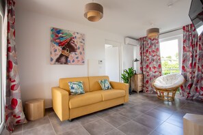 Exclusive Suite, 1 Queen Bed with Sofa bed, Balcony, Pool View | Living area | 32-inch Smart TV with digital channels, TV, Netflix