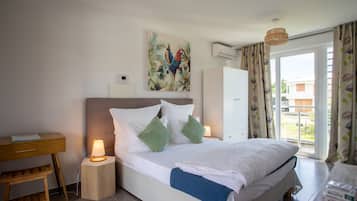 Superior Room, 1 Queen Bed, Balcony, Pool View | In-room safe, individually decorated, desk, laptop workspace