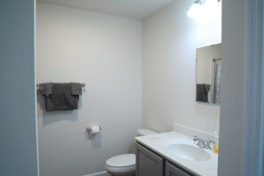 Shower, towels, soap, toilet paper