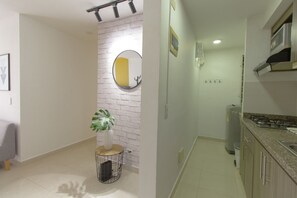 Fridge, microwave, stovetop, coffee/tea maker