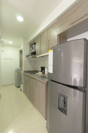 Fridge, microwave, stovetop, coffee/tea maker