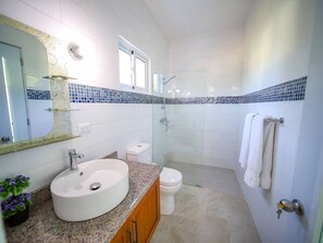 Shower, towels, soap, toilet paper
