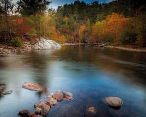 A river with clear water, surrounded by autumn-colored trees and rocks. - End of Summer Sale! GAMES & PRIVATE HOT TUB! Pup-friendly! 4mi to Pigeon Forge (Sevierville)
