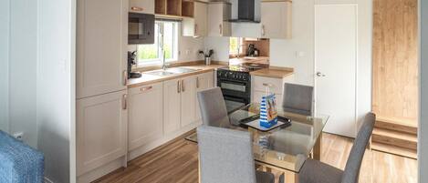 Fridge, stovetop, dishwasher, coffee/tea maker