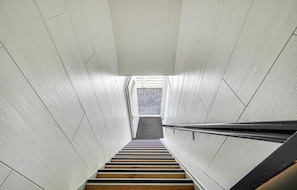 A staircase with white walls and wooden steps leading to an outdoor area. - Awesome apartment in Otterup with WiFi (Otterup)