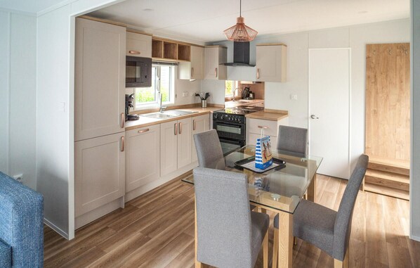 Fridge, stovetop, dishwasher, coffee/tea maker