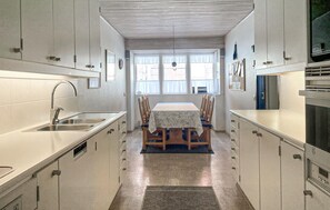 Fridge, stovetop, dishwasher, coffee/tea maker