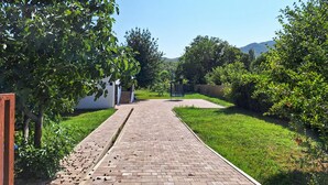 A brick pathway leading to a building with a door marked "27". - 3 bedroom lovely home in Blato na Cetini (Blato na Cetini)