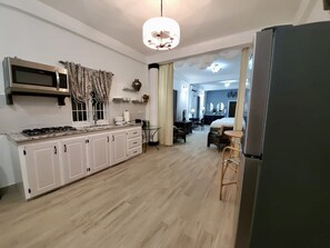 Fridge, microwave, stovetop, coffee/tea maker