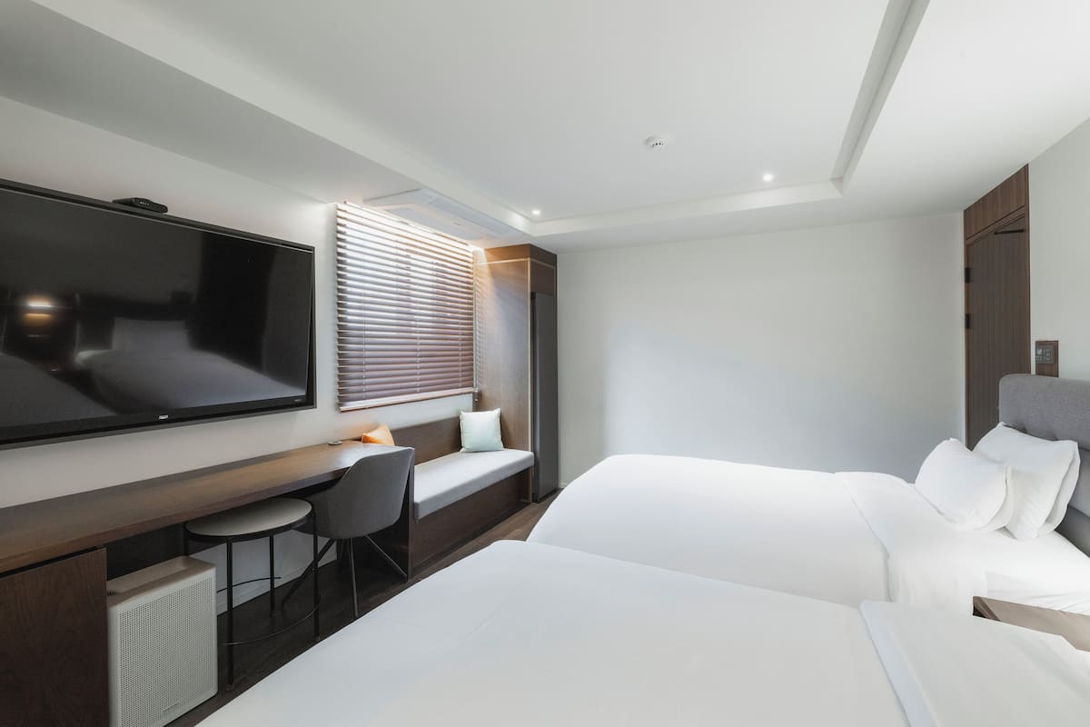 Quarto duplo luxo | 1 quarto, roupas de cama premium, edredons de pluma