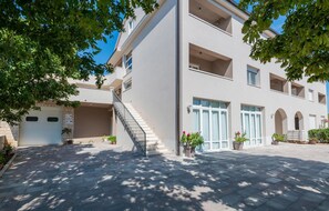 Stylish residential building with a symmetrical facade and central staircase.
