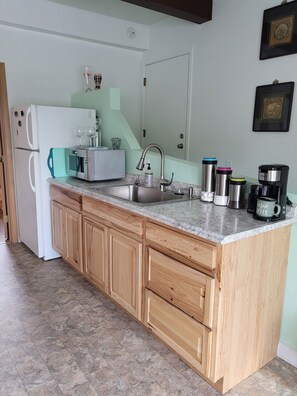 Fridge, microwave, stovetop, coffee/tea maker