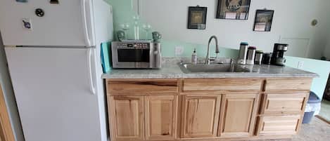 Fridge, microwave, stovetop, coffee/tea maker