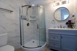 Shower, hair dryer, towels, soap