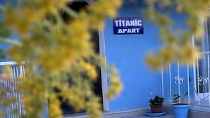 A building entrance with a sign reading "TITANIC APART". - The Titanic House (Denizli)