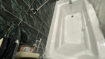 Jetted bath, hair dryer, towels, soap