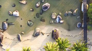 Private beach, white sand, beach umbrellas, scuba diving