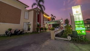 A hotel entrance with a sign for Assalaam Syariah Hotel, indicating meeting rooms, a 24-hour restaurant, and an ATM center. - Assalaam Syariah Hotel (Surakarta)