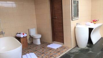 Bathtub, hair dryer, towels