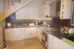 Family Apartment, Multiple Bedrooms, Sea Facing (Maritinas Stone Apartment On The) | Private kitchen | Fridge, oven, stovetop, coffee/tea maker - Maritinas Stone House & Apartment On The Beach (Pyrgos)