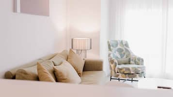 Standard Apartment | Living area | 50-inch Smart TV with digital channels, TV