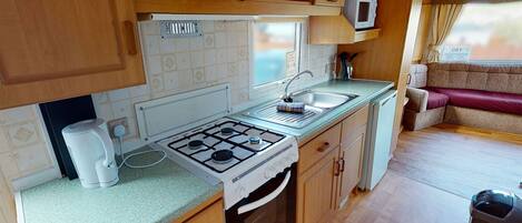 Refrigerador, horno, parrilla de estufa y tostadora