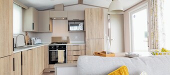 Modern, stylish and spacious 12ft-wide caravan with one double and one twin.