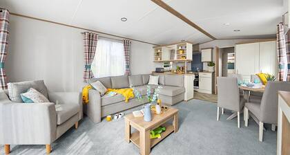 Spacious and modern 12ft-wide caravan with one double and two twin.