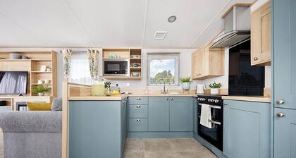 Spacious and modern 12ft-wide caravan with one double and two twin.