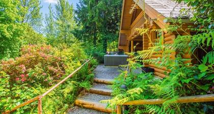 Timber lodge set in an elevated position with views of the lake.