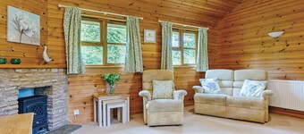 Lodge with one king-size double with en suite bathroom with shower.