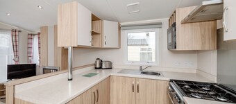 This contemporary caravan features one master double bedroom with two W.
