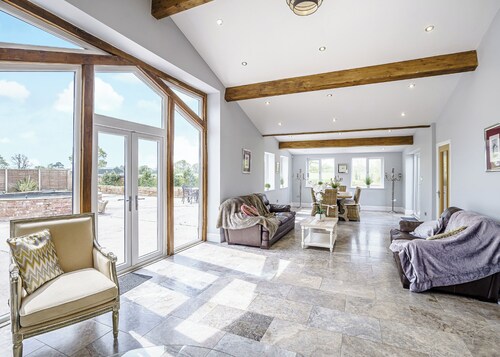 Modern spacious barn conversion with stylish finish.