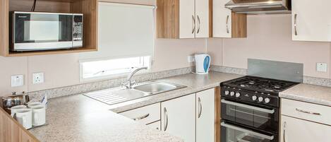 Refrigerador, horno, parrilla de estufa y tostadora