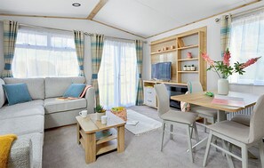 Living area - 12ft-wide caravan with two twin. (Milford-on-Sea, Nr Lymington)