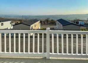 A residential area with houses and a clear view of the surrounding landscape.